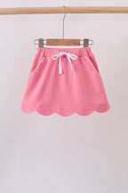Deep pink scallop hem bow skort