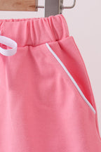 Deep pink scallop hem bow skort